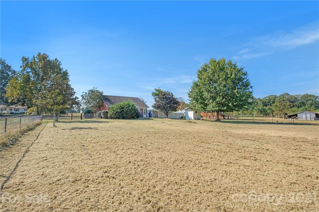6107 Stack Road Monroe, NC 28112 - Photo 22 of 24 a view of open space with wooden fence