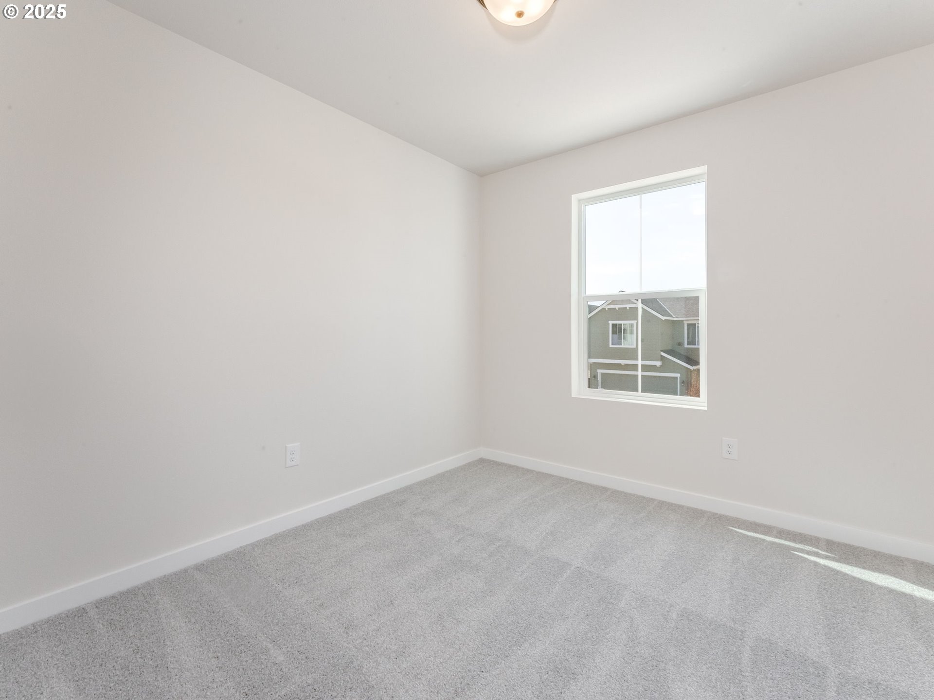 744 Northwest 178th Street Ridgefield, WA 98642 - Photo 13 of 25 an empty room with windows