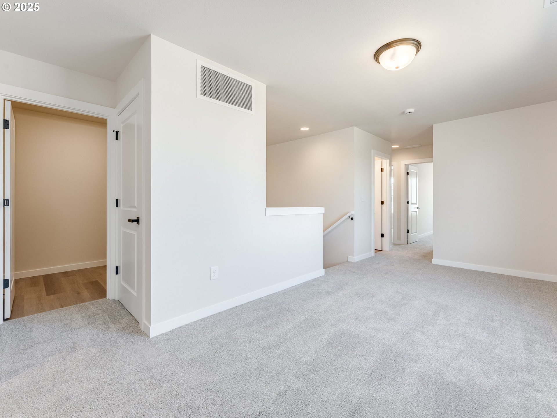 744 Northwest 178th Street Ridgefield, WA 98642 - Photo 17 of 25 an empty room with a cabinet and a window