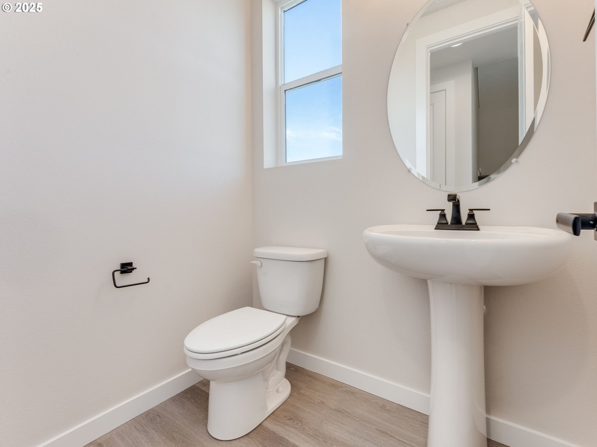 744 Northwest 178th Street Ridgefield, WA 98642 - Photo 9 of 25 a bathroom with a toilet sink and mirror