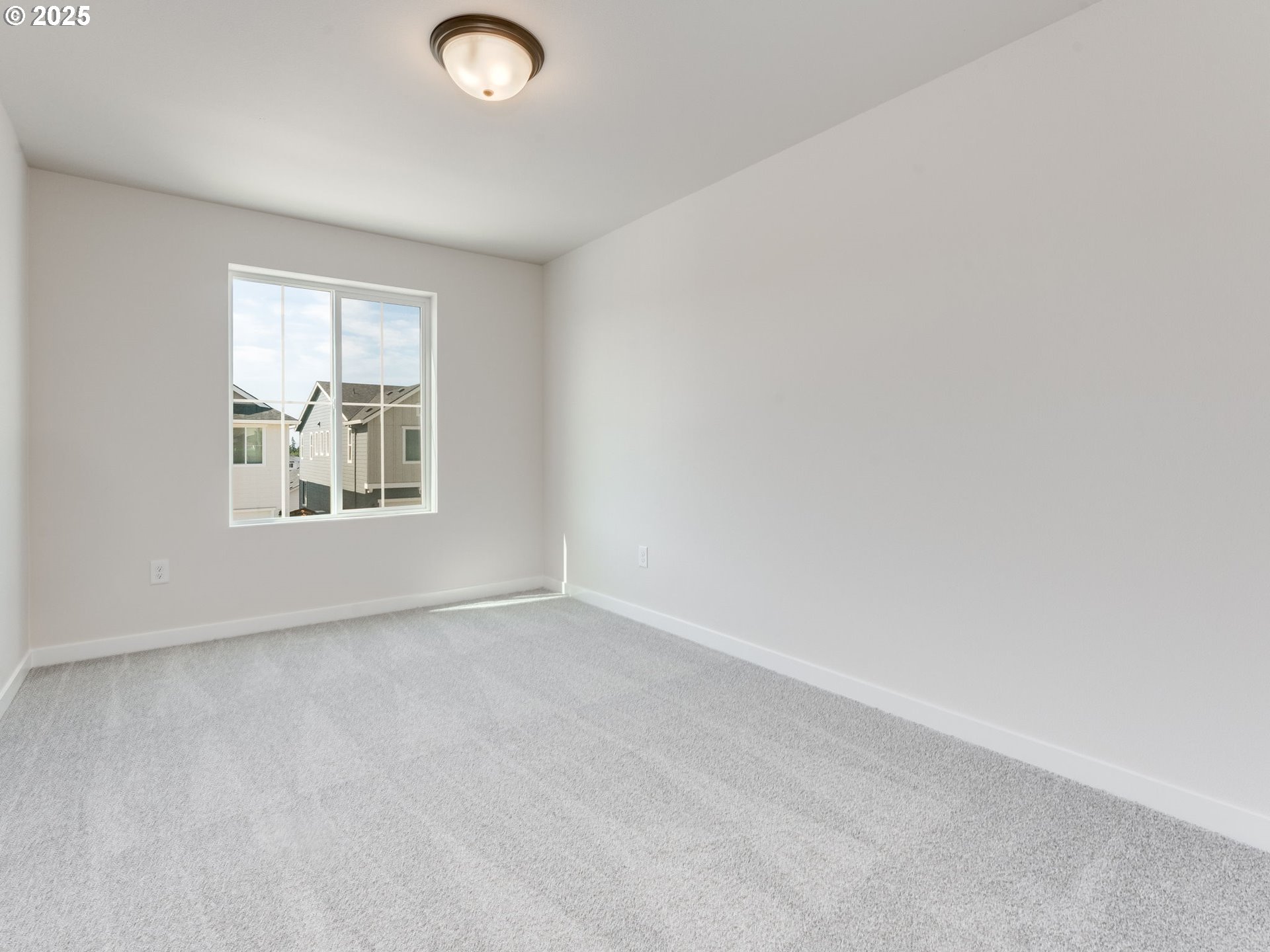 744 Northwest 178th Street Ridgefield, WA 98642 - Photo 10 of 25 an empty room with windows