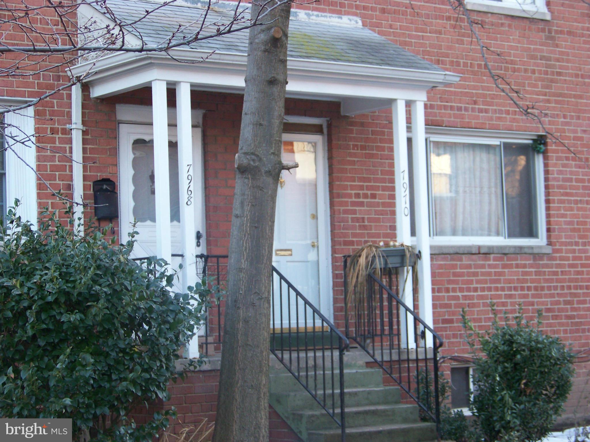 7970 Riggs Road, Unit 7970 Hyattsville, MD 20783 - Photo 2 of 23 a view of a brick house with a small porch