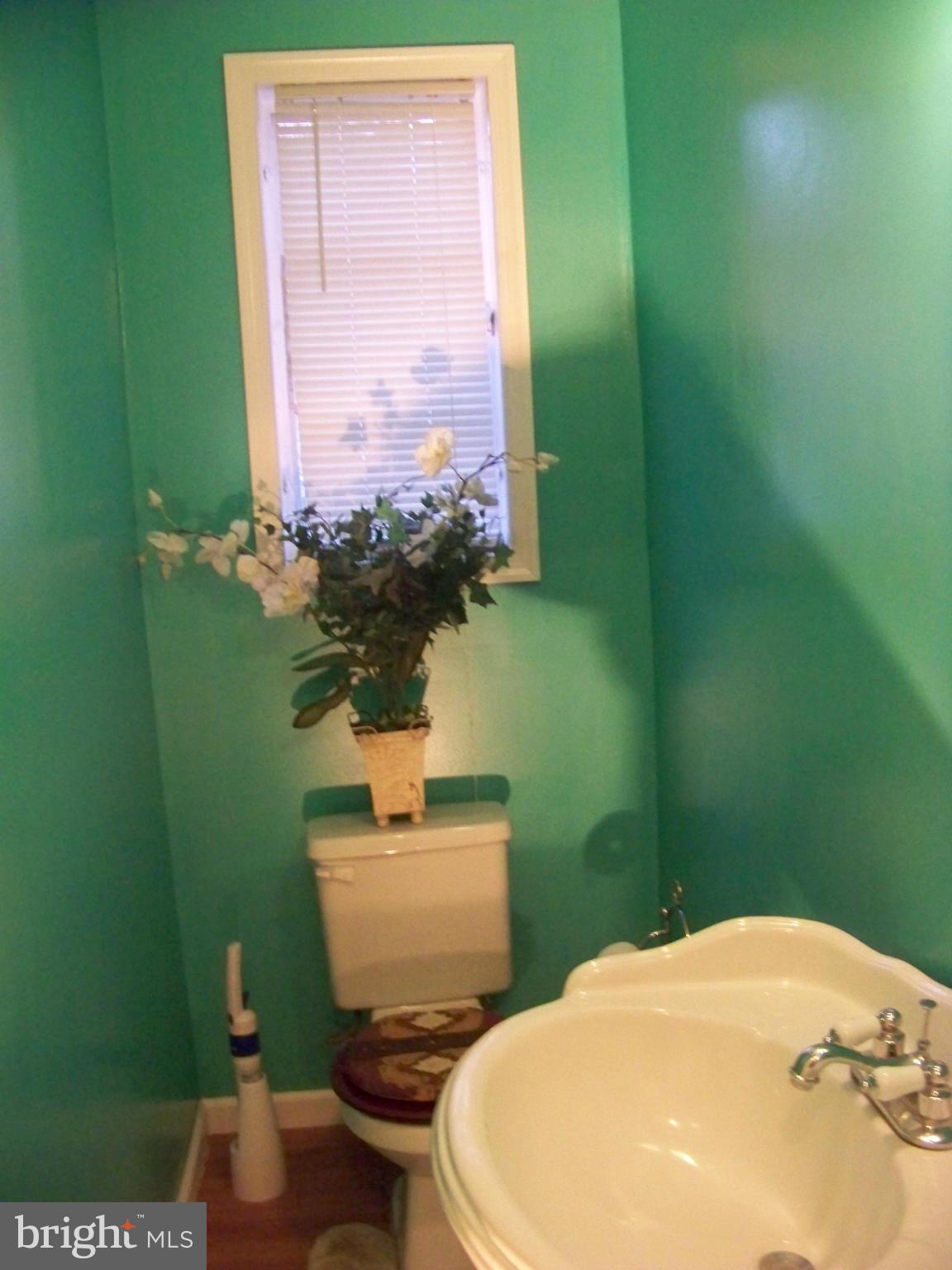 7970 Riggs Road, Unit 7970 Hyattsville, MD 20783 - Photo 12 of 23 a bathroom with a toilet and a sink