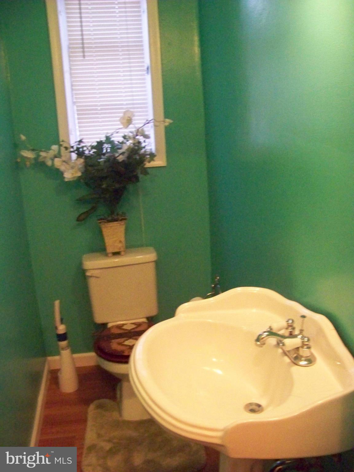 7970 Riggs Road, Unit 7970 Hyattsville, MD 20783 - Photo 13 of 23 a bathroom with a sink and a toilet