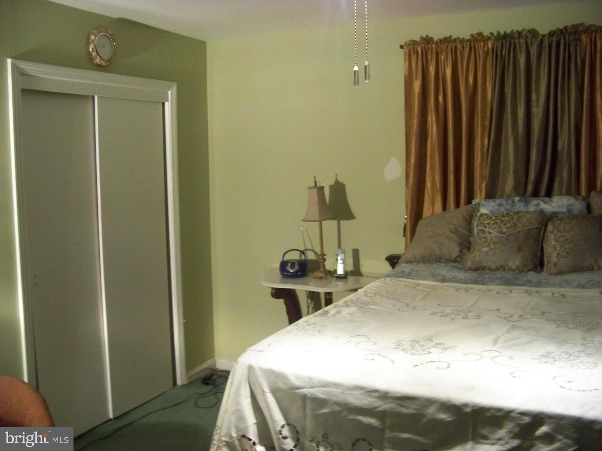7970 Riggs Road, Unit 7970 Hyattsville, MD 20783 - Photo 17 of 23 a bedroom with a bed and a closet