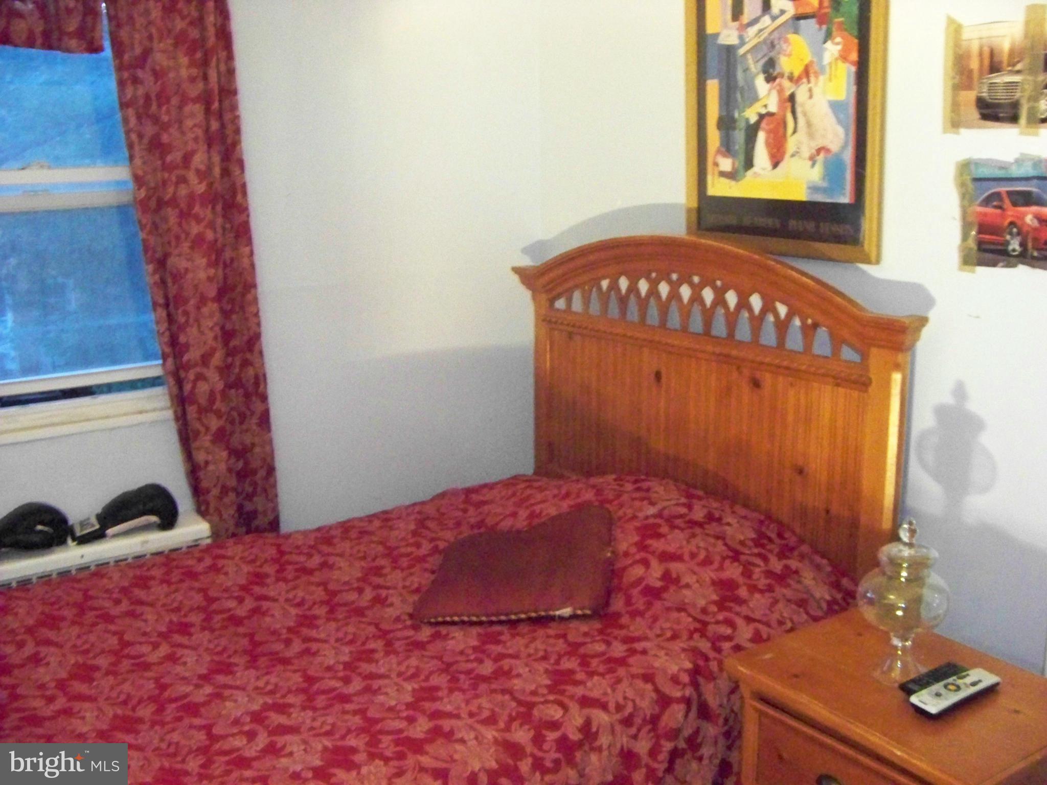 7970 Riggs Road, Unit 7970 Hyattsville, MD 20783 - Photo 18 of 23 a bedroom with a bed and a window