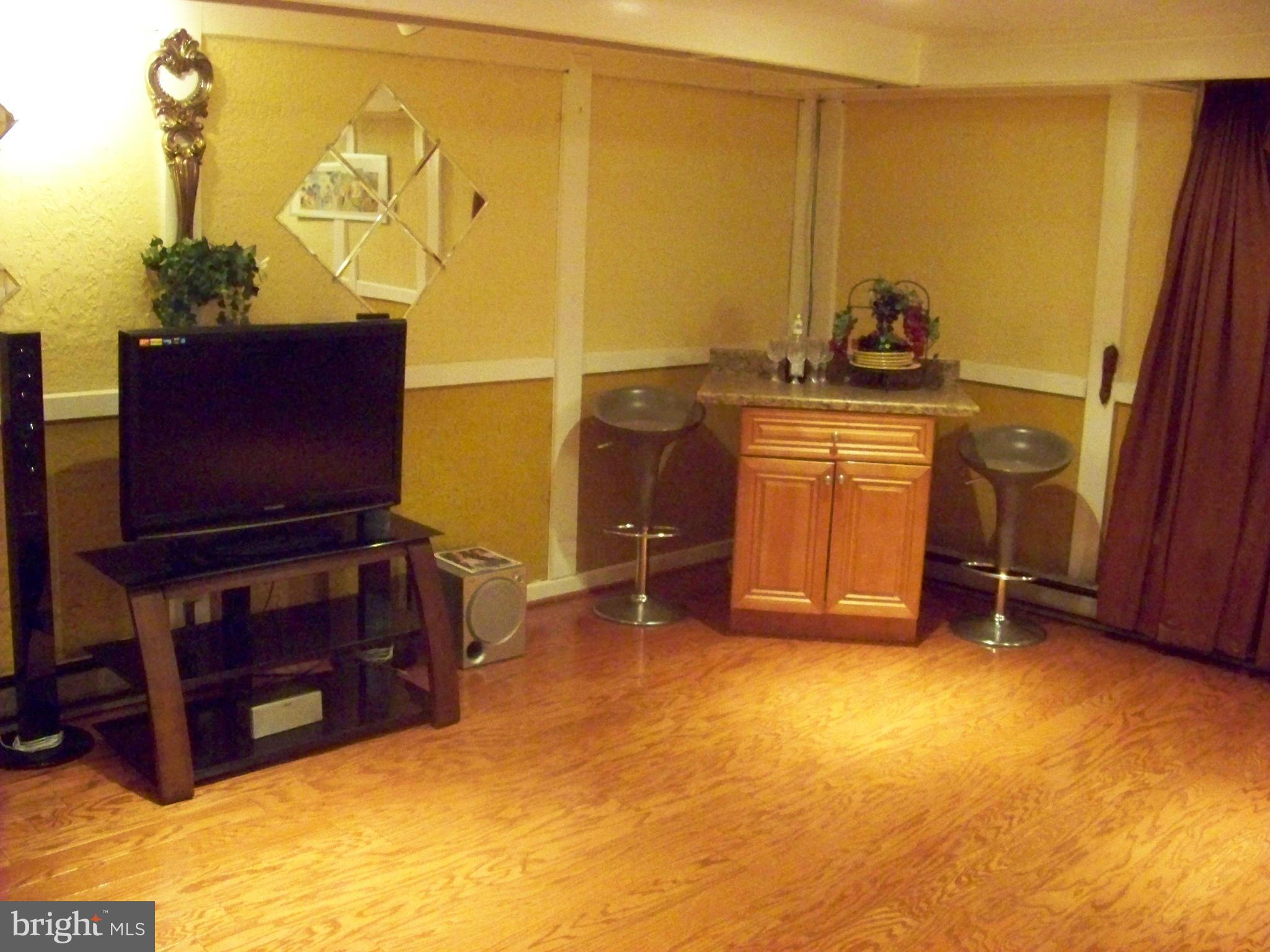 7970 Riggs Road, Unit 7970 Hyattsville, MD 20783 - Photo 20 of 23 a room with a chair and painted walls