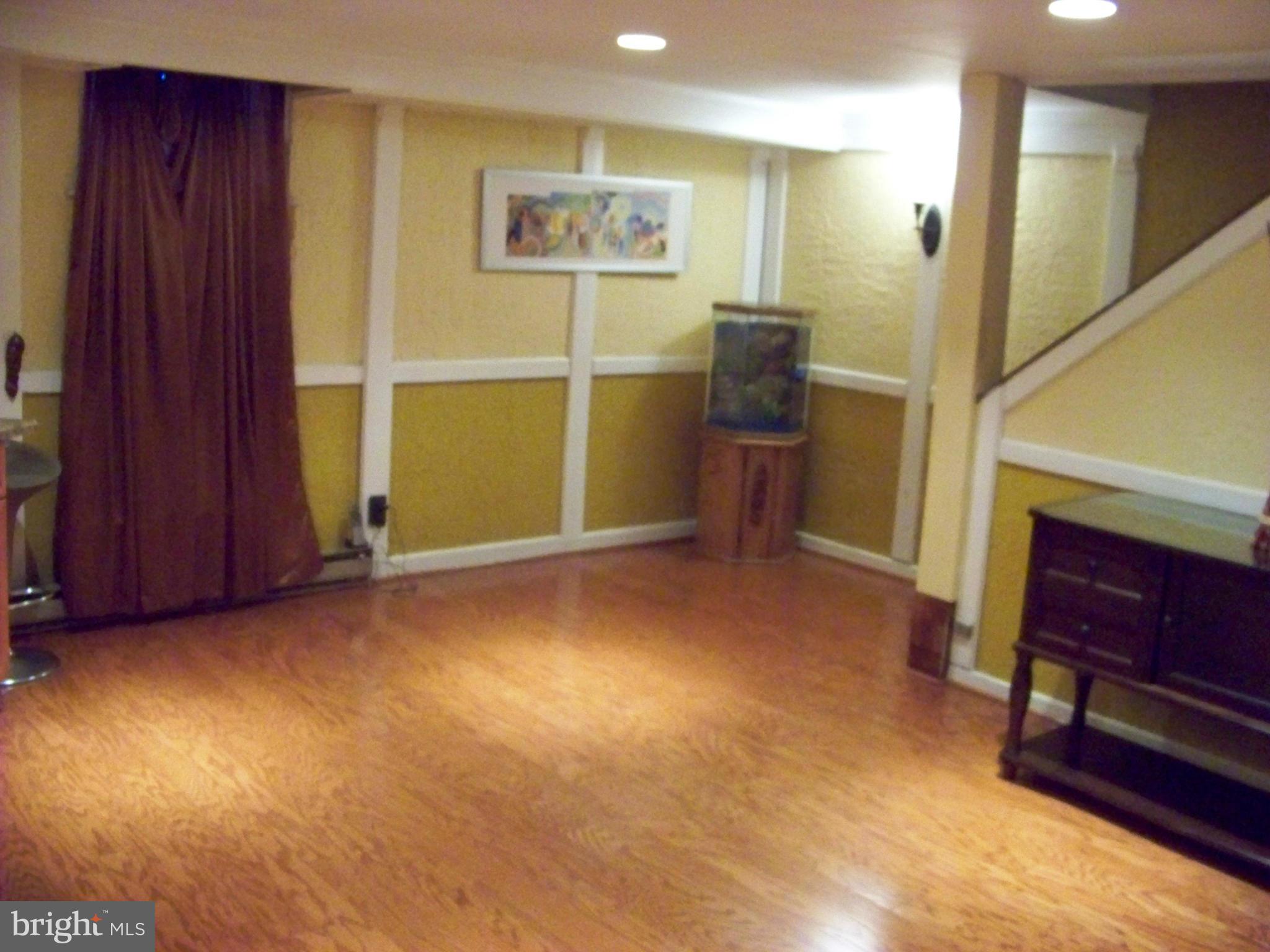 7970 Riggs Road, Unit 7970 Hyattsville, MD 20783 - Photo 21 of 23 a view of an empty room with furniture and windows