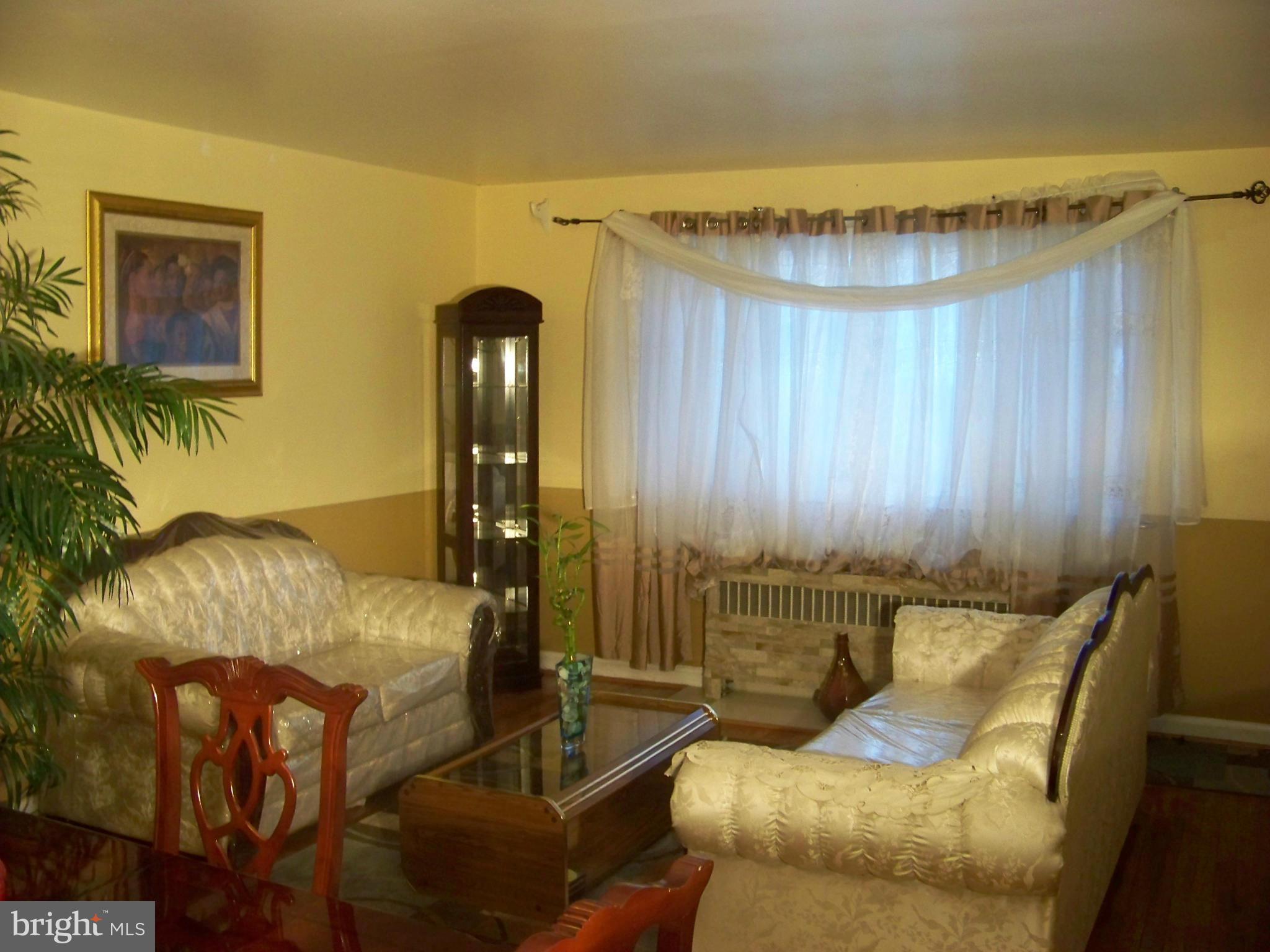 7970 Riggs Road, Unit 7970 Hyattsville, MD 20783 - Photo 4 of 23 a living room with furniture and a window
