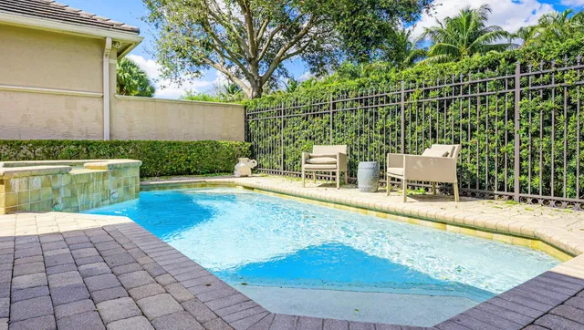 a view of a swimming pool with a patio