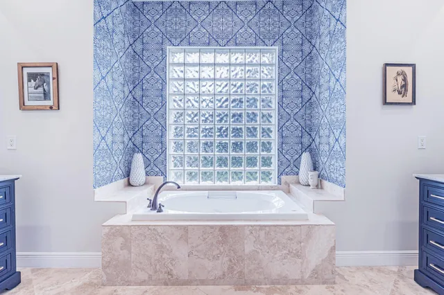 a bath tub sitting next to a shower