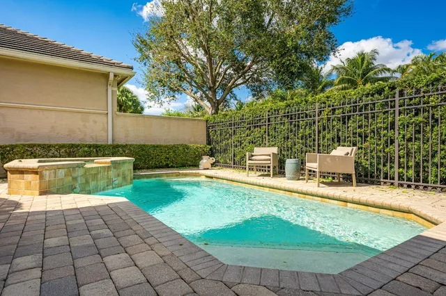 a view of a swimming pool with a yard