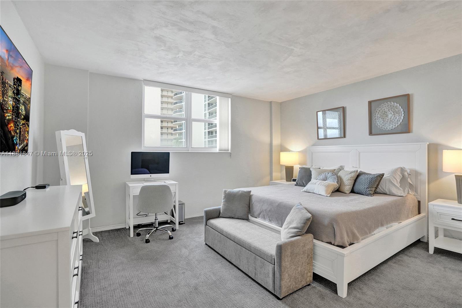 4250 Galt Ocean Drive, Unit 4P Fort Lauderdale, FL 33308 - Photo 11 of 29 a bedroom with a bed couch and a window