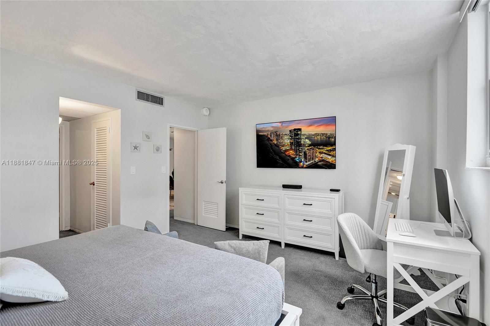 4250 Galt Ocean Drive, Unit 4P Fort Lauderdale, FL 33308 - Photo 13 of 29 a bedroom with furniture and a flat screen tv