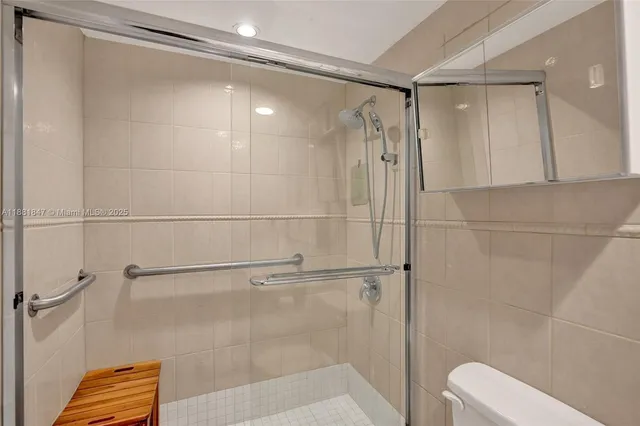 a bathroom with a shower and a toilet