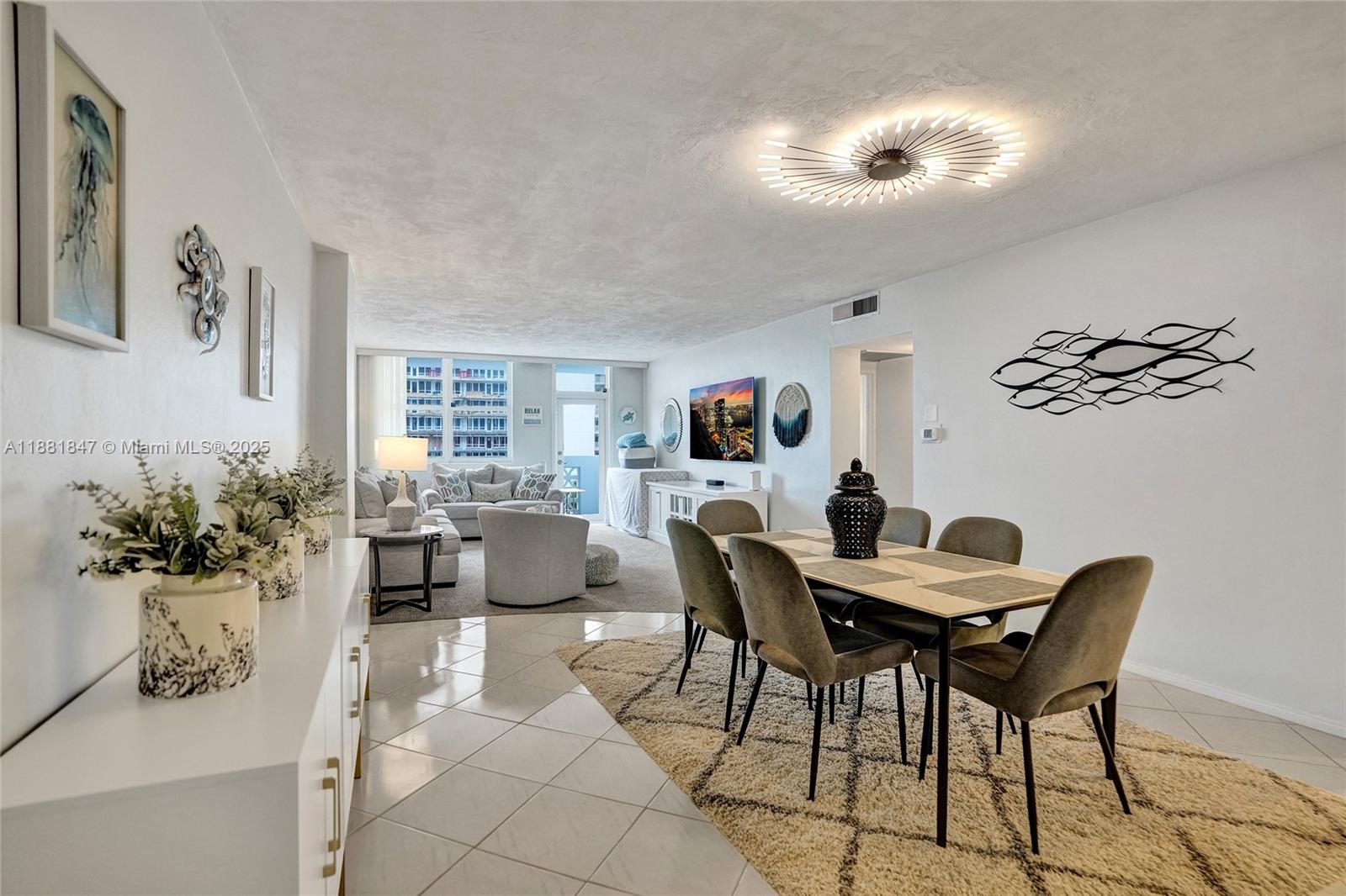 4250 Galt Ocean Drive, Unit 4P Fort Lauderdale, FL 33308 - Photo 2 of 29 a view of a dining room with furniture and a potted plant