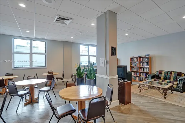 a view of a dining room with furniture window and outside view