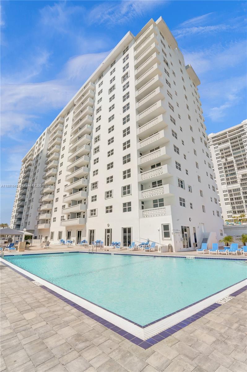 4250 Galt Ocean Drive, Unit 4P Fort Lauderdale, FL 33308 - Photo 26 of 29 a view of a tall building next to a yard