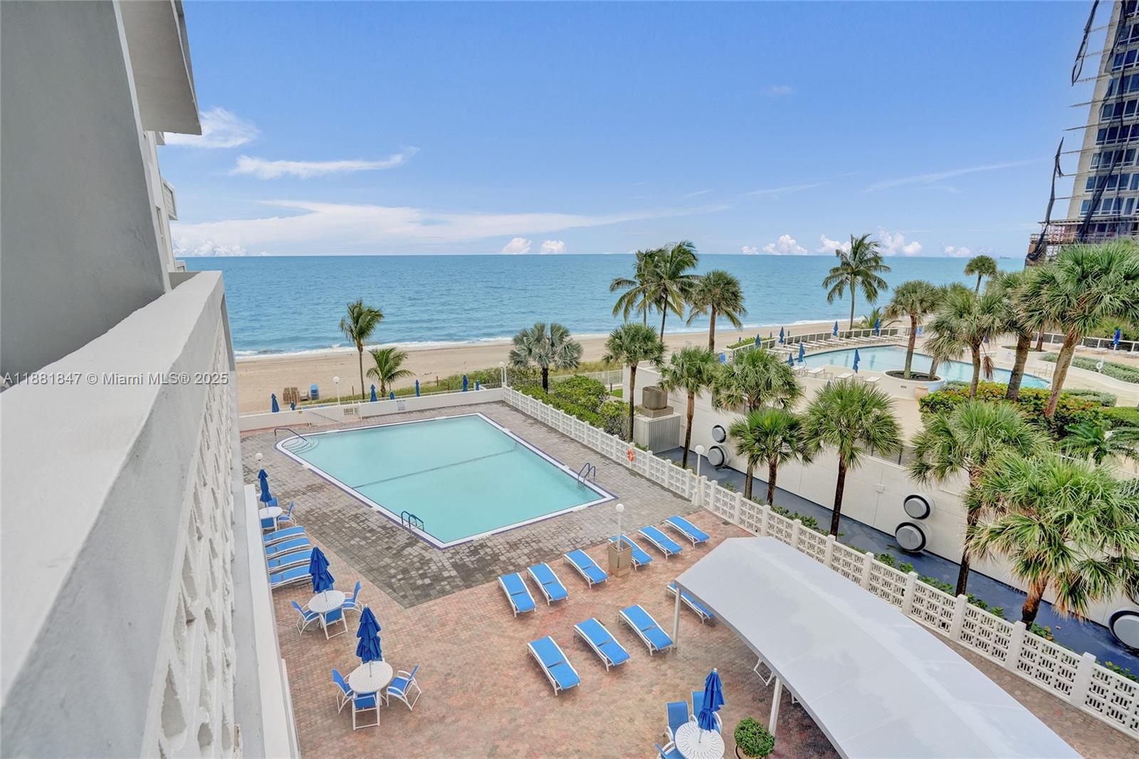 4250 Galt Ocean Drive, Unit 4P Fort Lauderdale, FL 33308 - Photo 9 of 29 a view of a terrace with a table and chairs