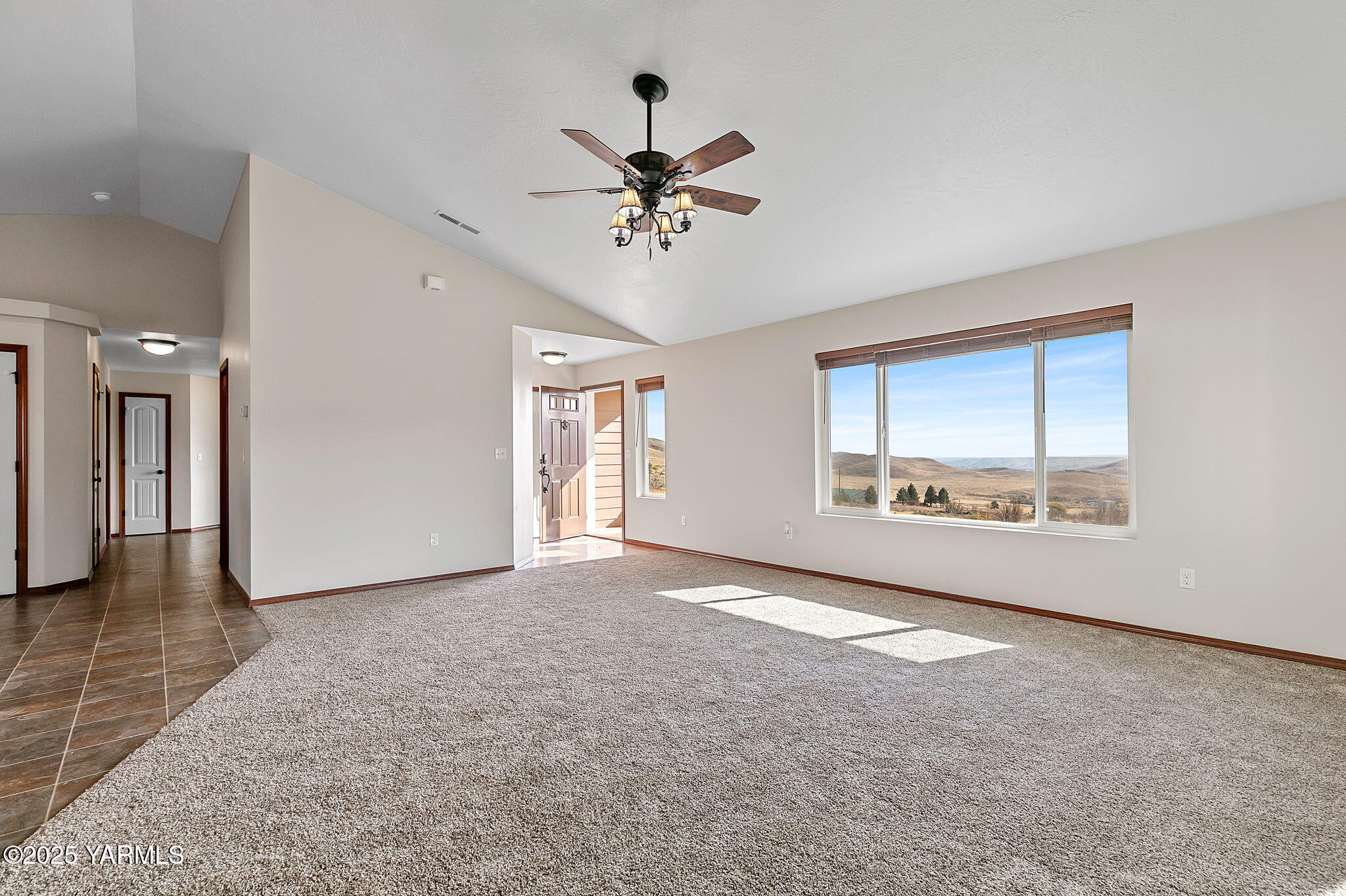 1101 Elk Ridge Lane Selah, WA 98942 - Photo 6 of 28 wooden floor in an empty room with a window