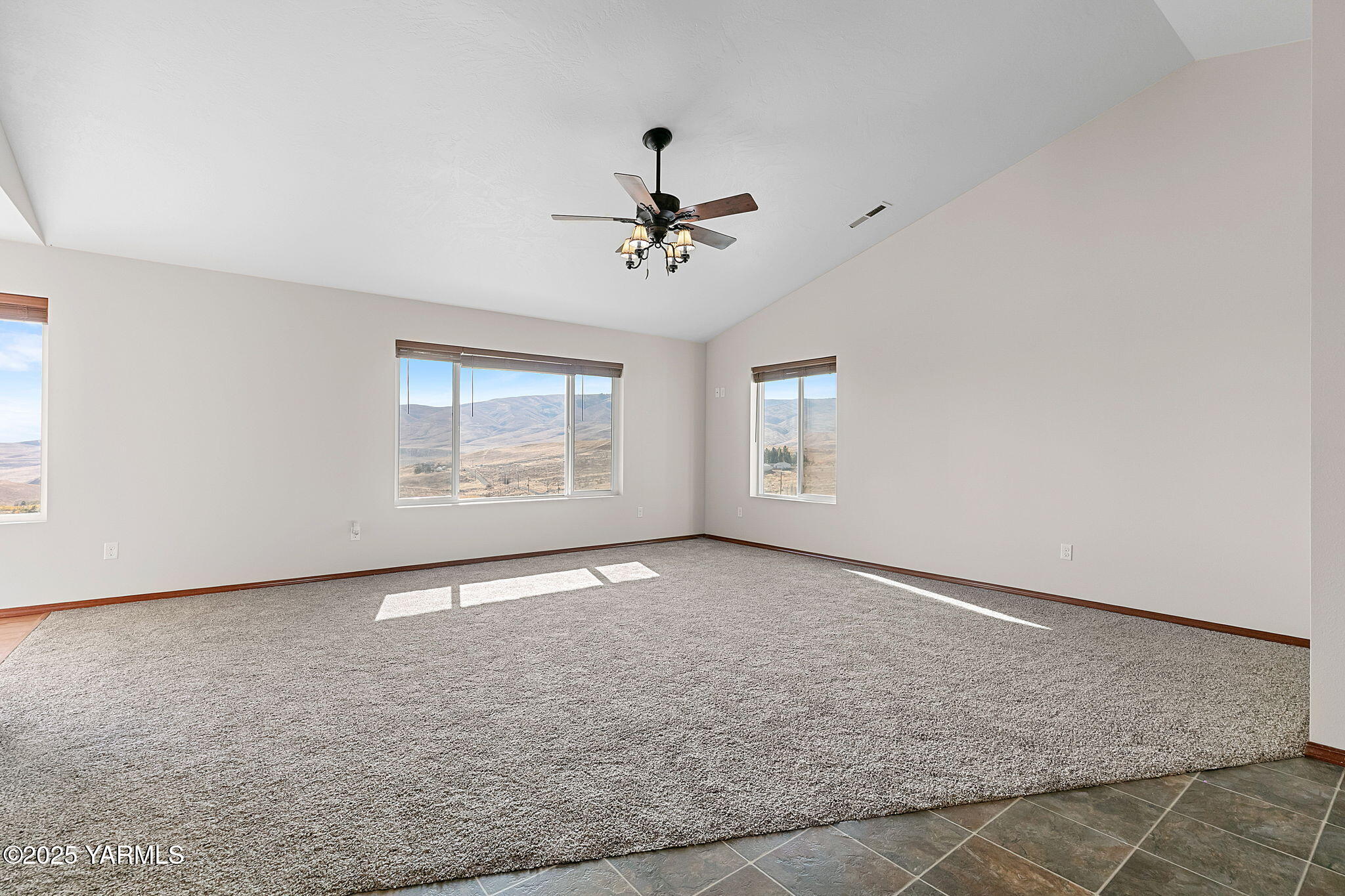 1101 Elk Ridge Lane Selah, WA 98942 - Photo 7 of 28 an empty room with windows and fan