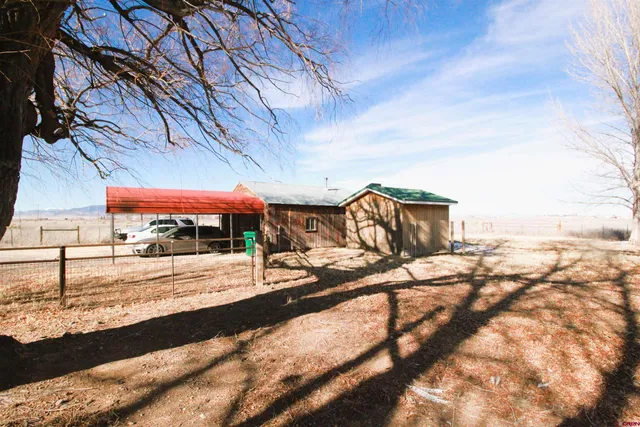 a view of a backyard of the house