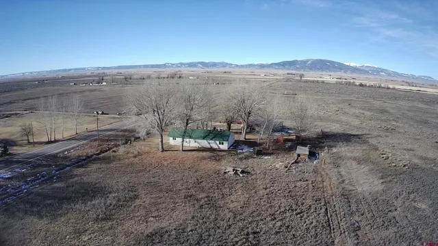 a view of a yard with an outdoor seating