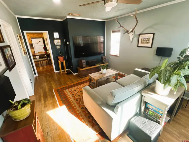 a living room with furniture and flat screen tv