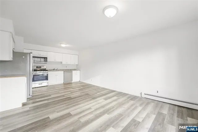a view of kitchen with wooden floor