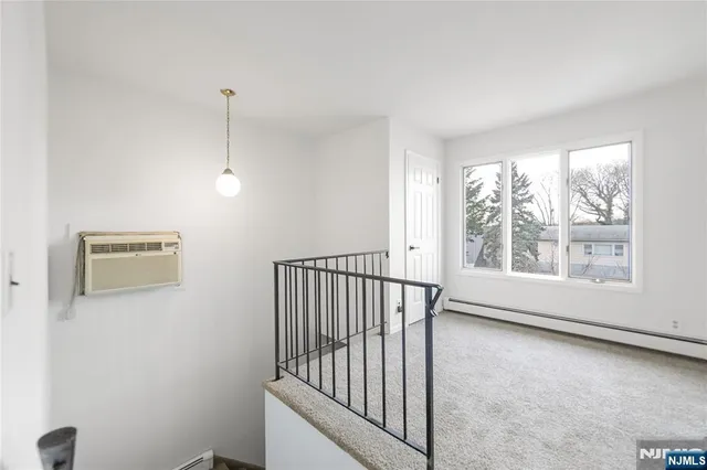 a view of hallway with windows