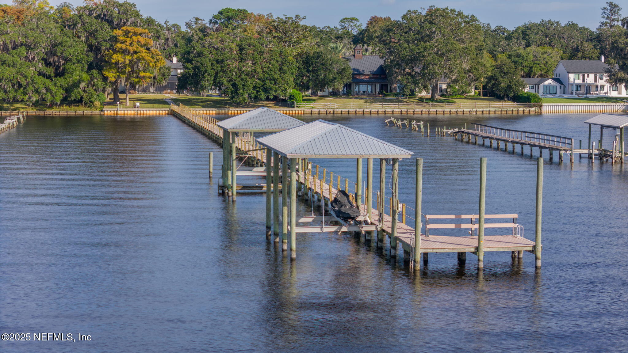 a swimming pool with outdoor seating and yard