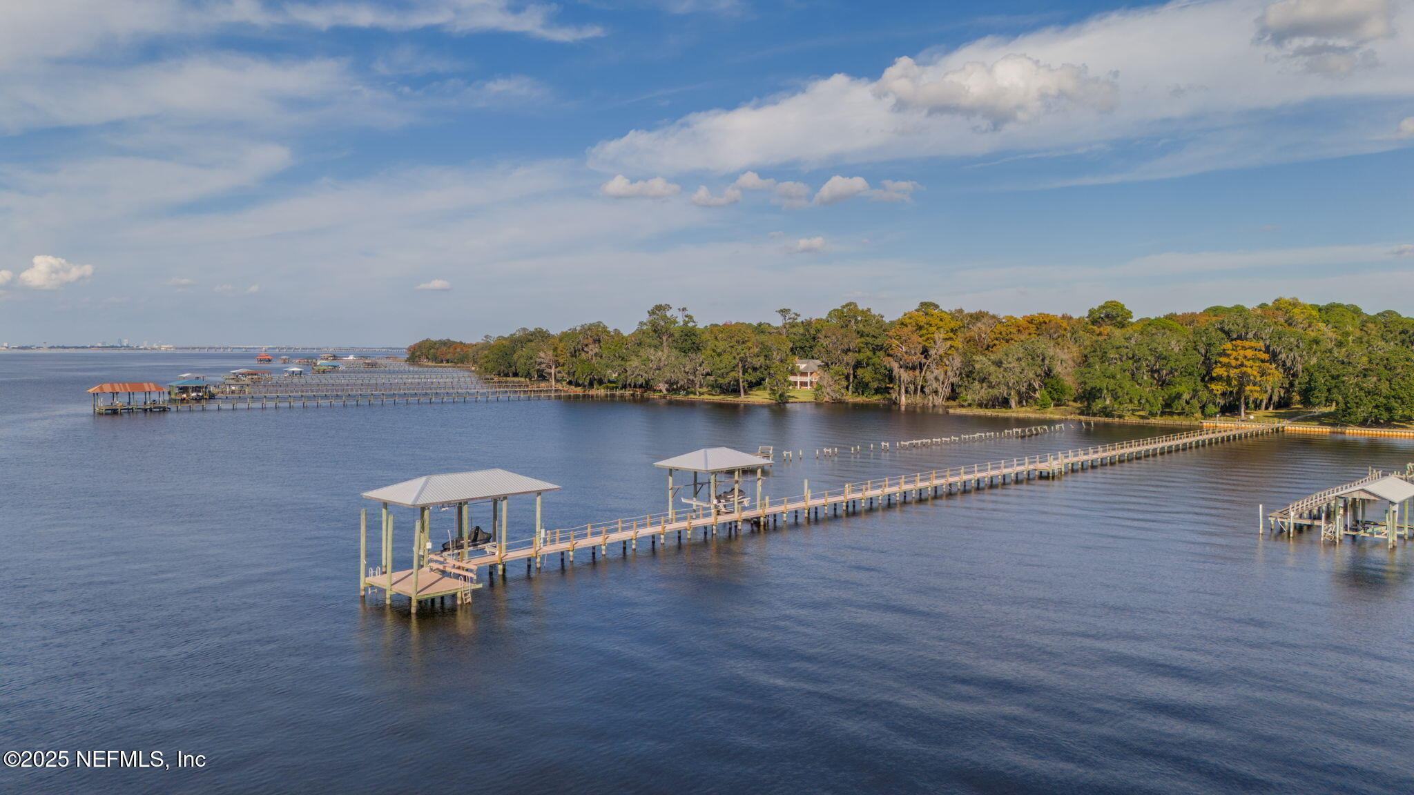13224 Mandarin Road Jacksonville, FL 32223 - Photo 12 of 36 an aerial view of a house with wooden floor and lake view