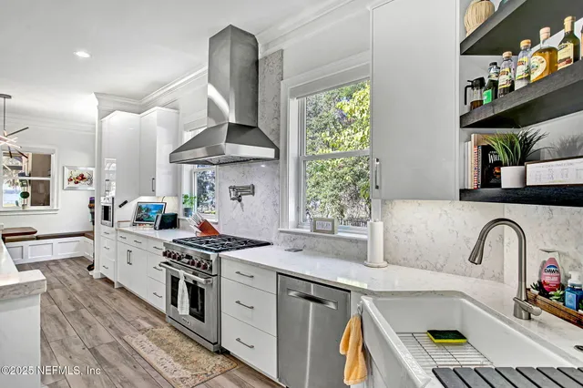 a kitchen that has a lot of cabinets in it