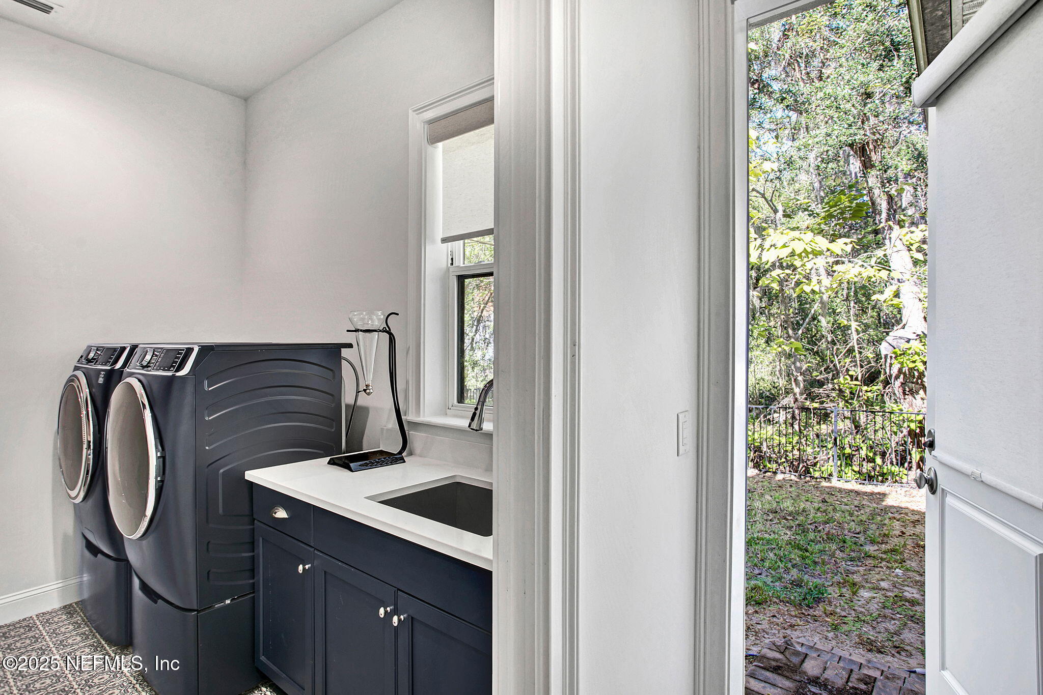 13224 Mandarin Road Jacksonville, FL 32223 - Photo 34 of 36 a bathroom with a sink and a mirror