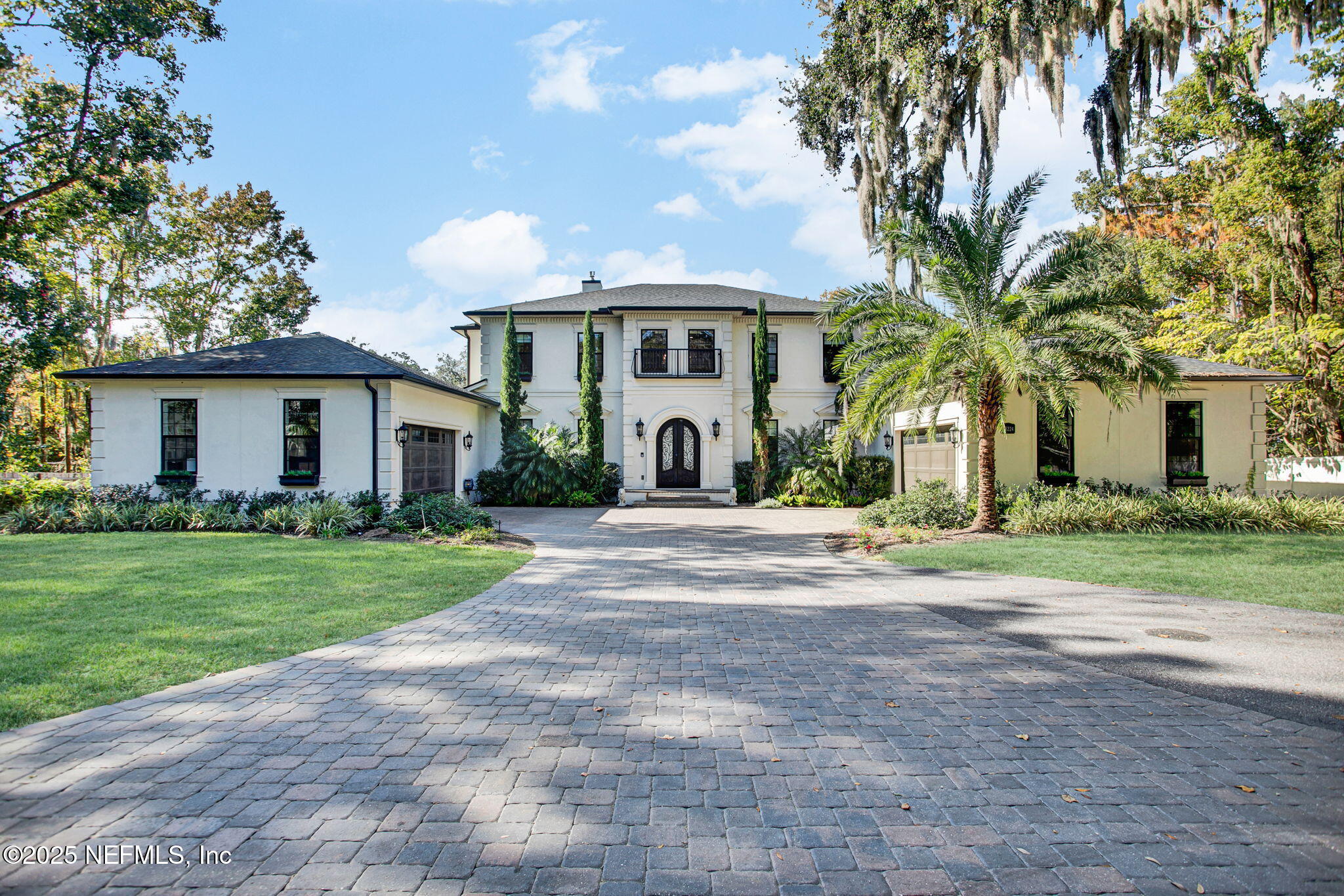 13224 Mandarin Road Jacksonville, FL 32223 - Photo 4 of 36 a front view of a house with a garden and trees