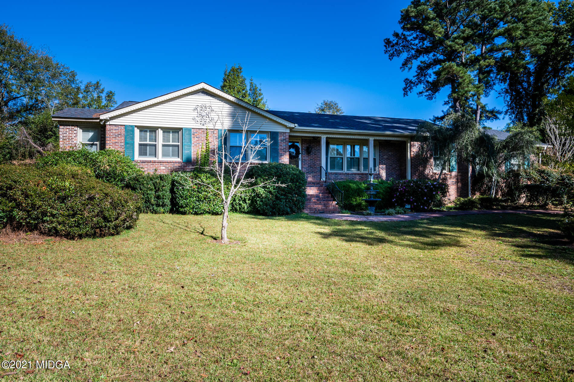6434 Bevin Drive Macon, GA 31216 - Photo 2 of 28 a view of a house with a swimming pool