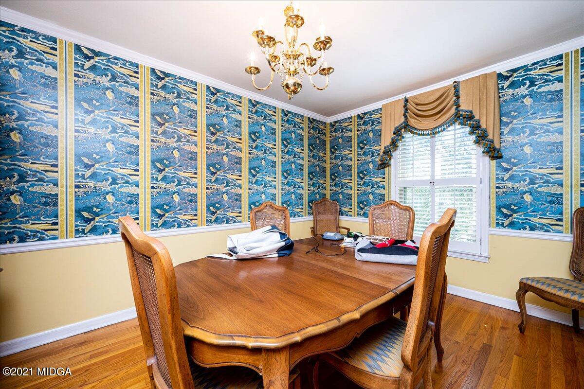 6434 Bevin Drive Macon, GA 31216 - Photo 17 of 28 a dining room with furniture and wooden floor
