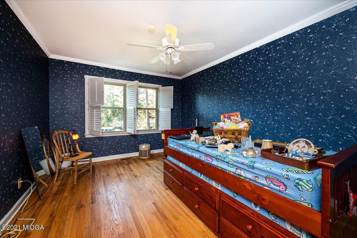 6434 Bevin Drive Macon, GA 31216 - Photo 20 of 28 a bed room with furniture and a chandelier