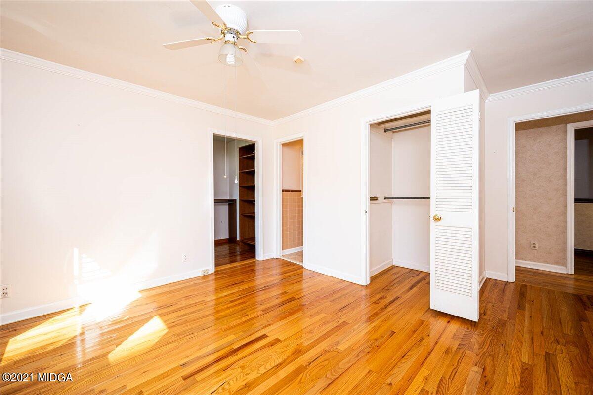 6434 Bevin Drive Macon, GA 31216 - Photo 25 of 28 a bedroom with a bed and wooden floor