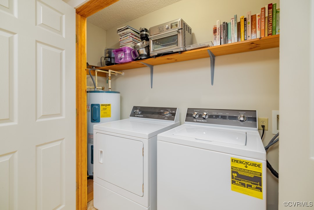 96 Horseshoe Road Jarratt, VA 23867 - Photo 13 of 36 Laundry room featuring water heater, independent w