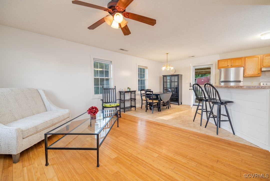 96 Horseshoe Road Jarratt, VA 23867 - Photo 2 of 36 Living room with ceiling fan with notable chandeli
