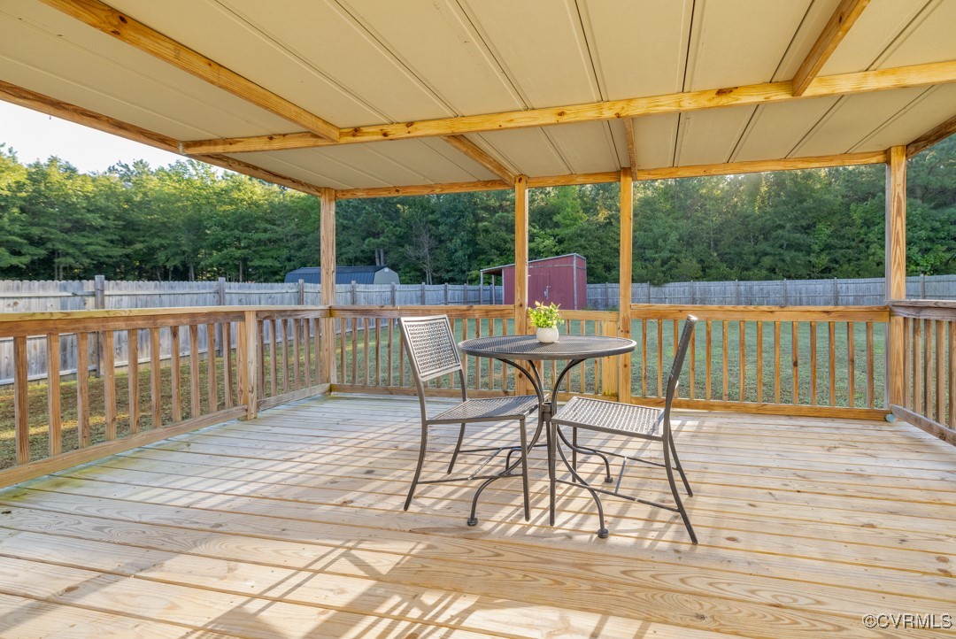 96 Horseshoe Road Jarratt, VA 23867 - Photo 6 of 36 Wooden terrace with a shed