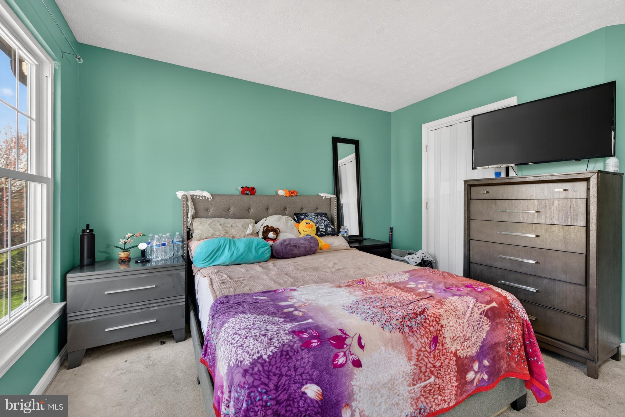 611 Hunting Ridge Drive Frederick, MD 21703 - Photo 31 of 50 a bedroom with a bed and flat screen tv