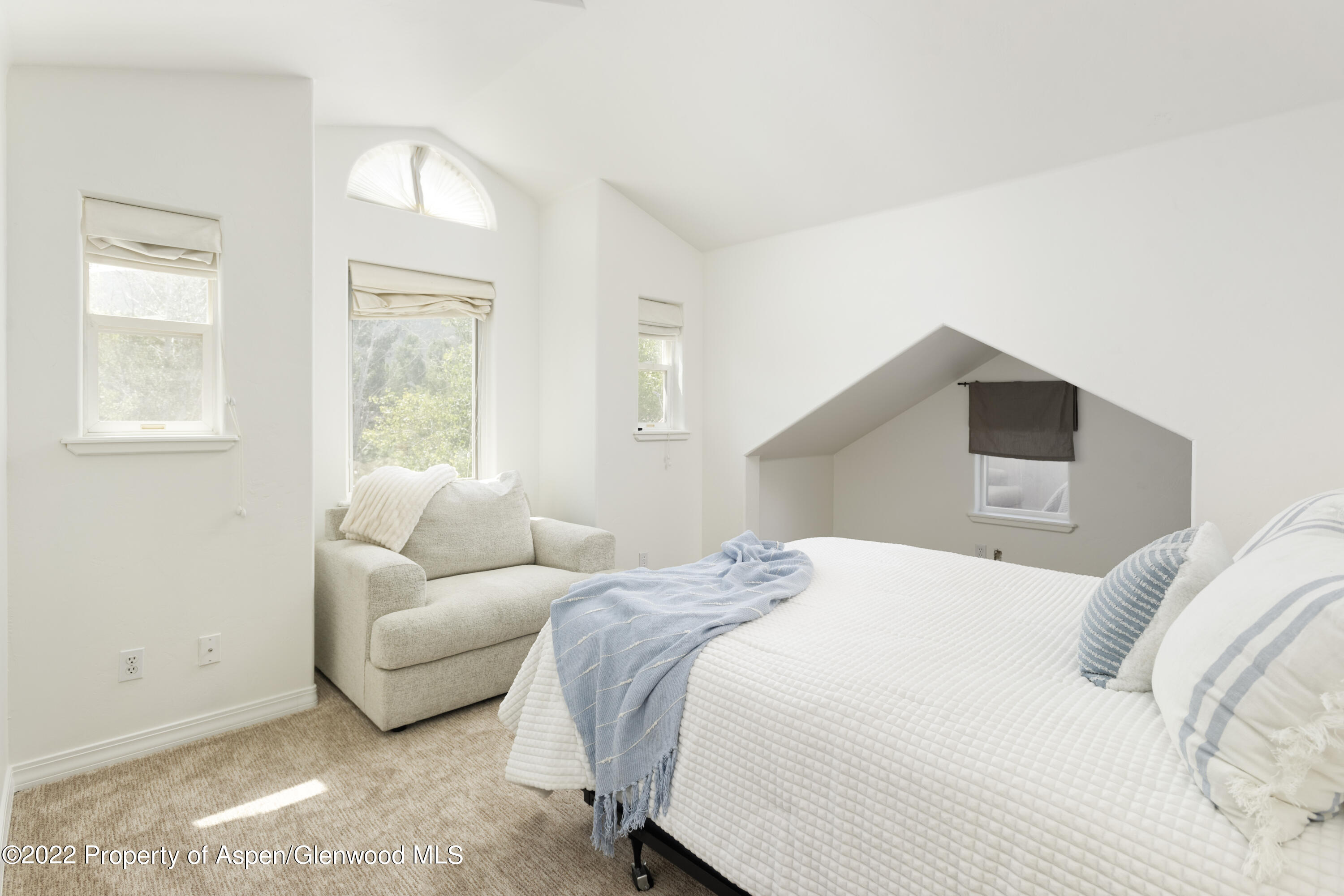 965 Lupine Circle Basalt, CO 81621 - Photo 19 of 31 a bedroom with a bed and a window