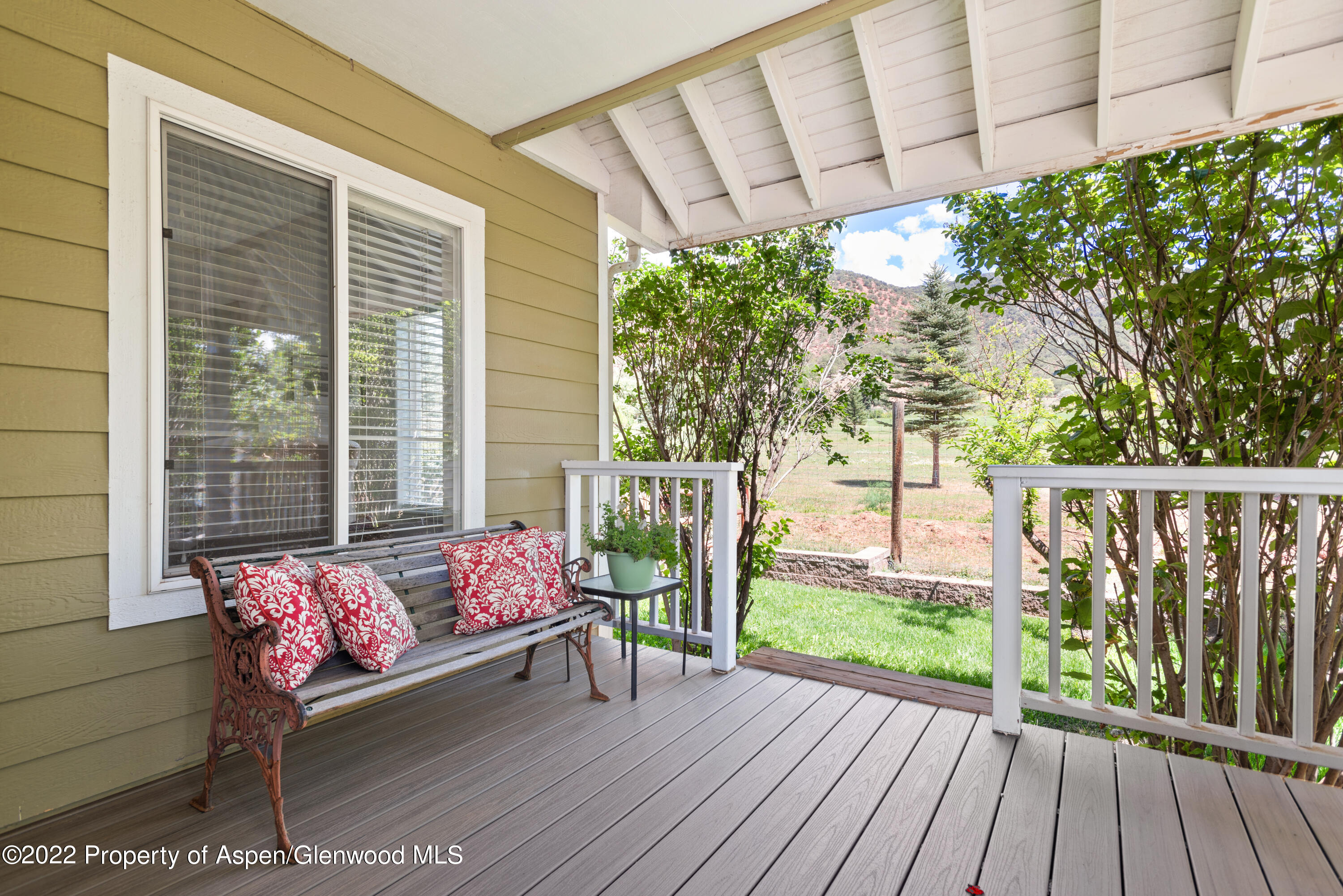 965 Lupine Circle Basalt, CO 81621 - Photo 2 of 31 a balcony with wooden floor and furniture
