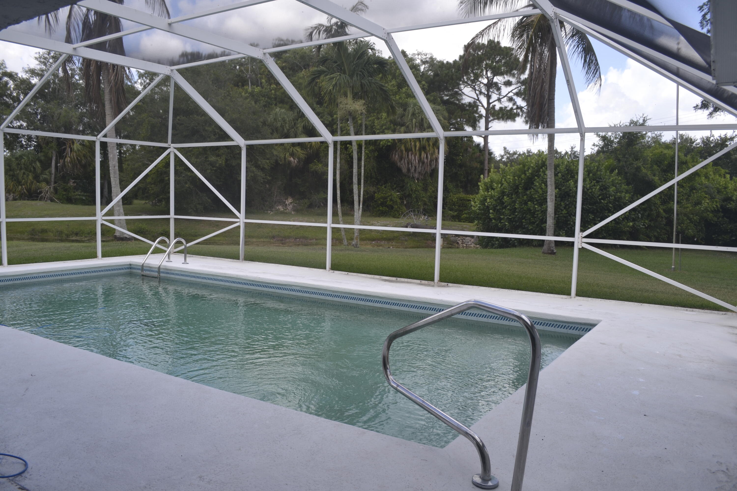 1104 Raintree Lane Wellington, FL 33414 - Photo 15 of 30 Pool screen enclosed view .39 acre