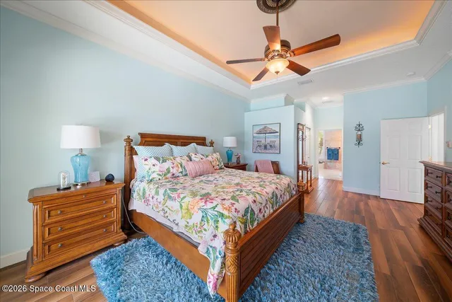 a bedroom with a bed window and a table