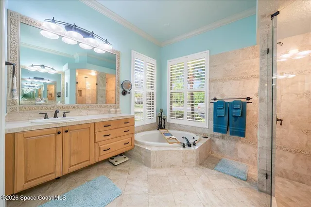 a bedroom with a bed and a chair with the bookshelf