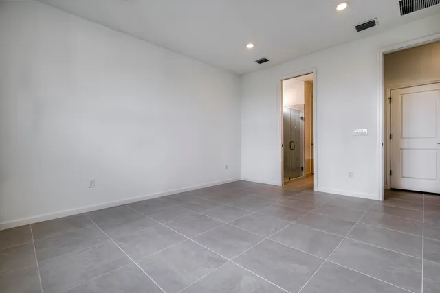 a bathroom with a double vanity sink mirror and shower