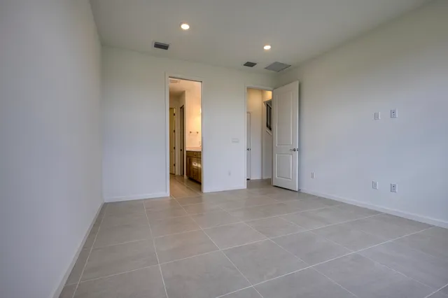 a bathroom with a double vanity sink and mirror
